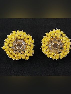 Ethnicyellow pearl studs crafted with ad stones